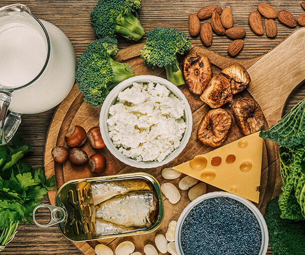 A platter of calcium rich food including milk, cheese and sardines